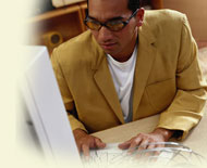 Photo of a man using a computer